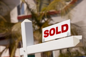 6846042 - close-up of sold real estate sign in front of house.