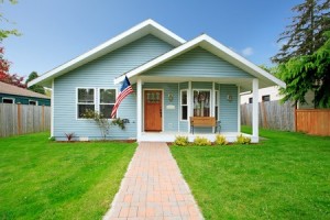 26838604 - small clapboard siding house  view of porch with bench and walkway